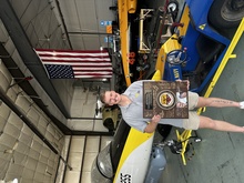 Man poses in front of jet.