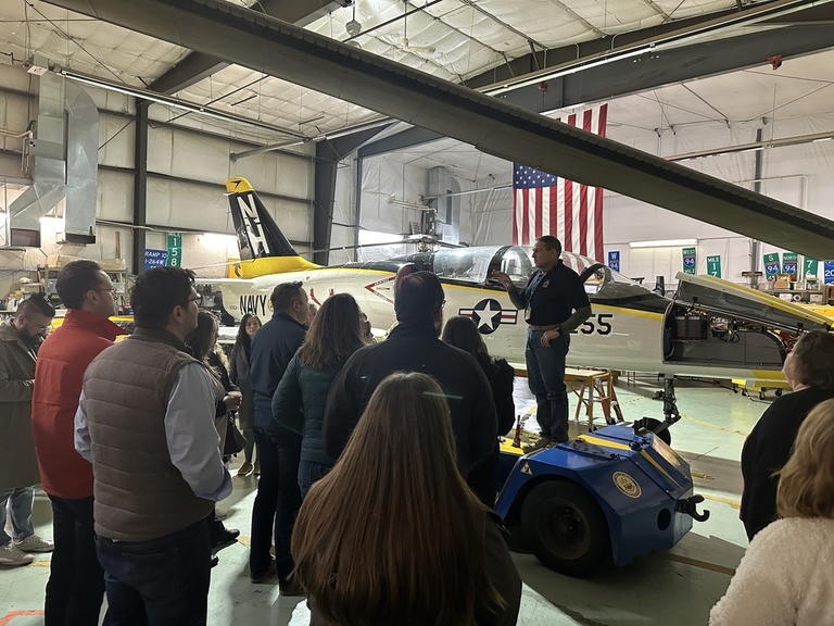 A group tours the OPL hangar
