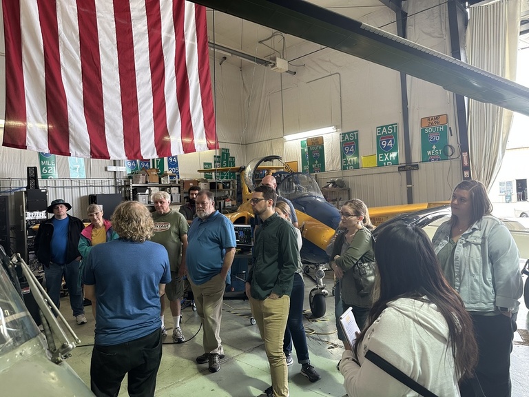 A group of people in the OPL hangar