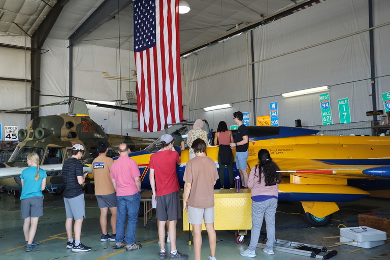 A tour group inside the OPL hangar