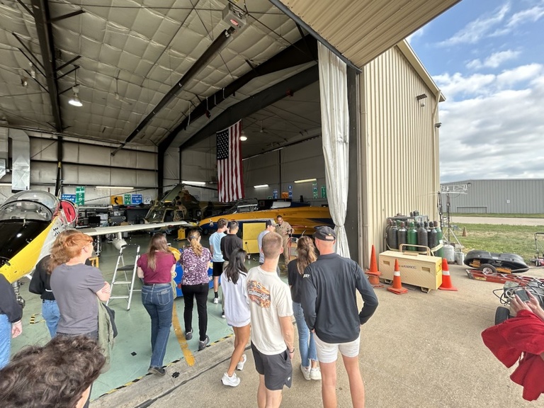 A tour group in the OPL hangar