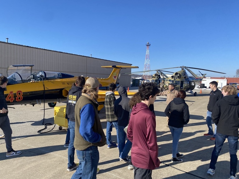 A group of students outside the OPL hangar
