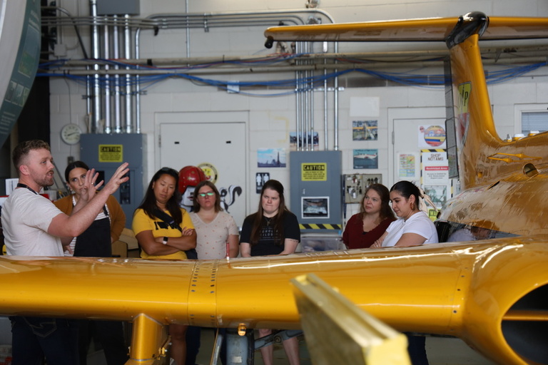A tour group in the OPL hangar