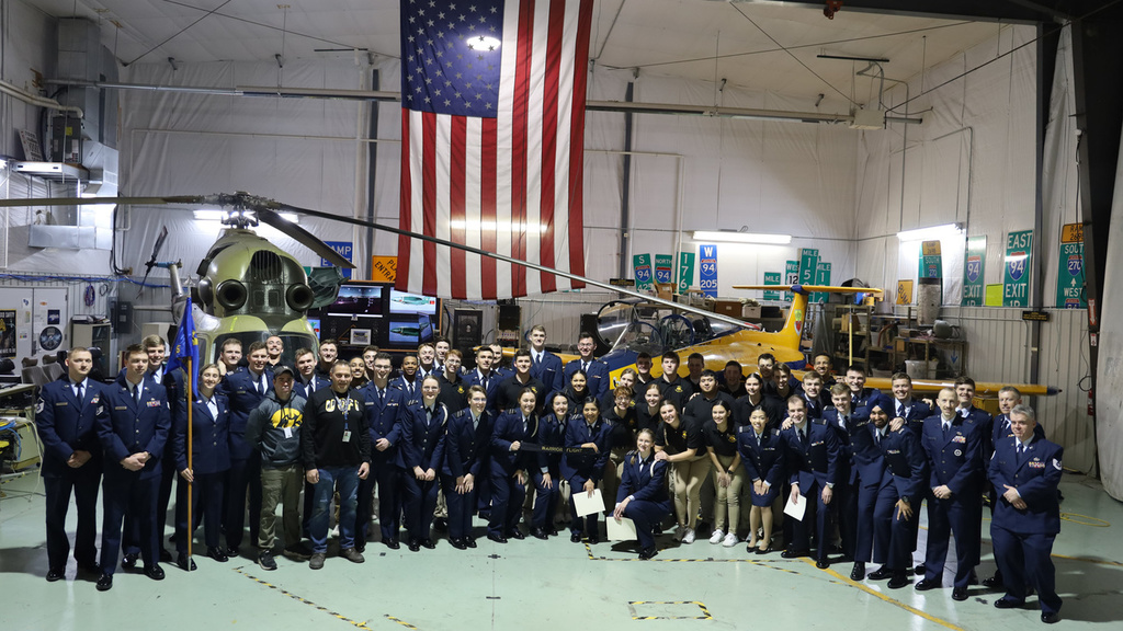 Group photo of ROTC members in the OPL hangar