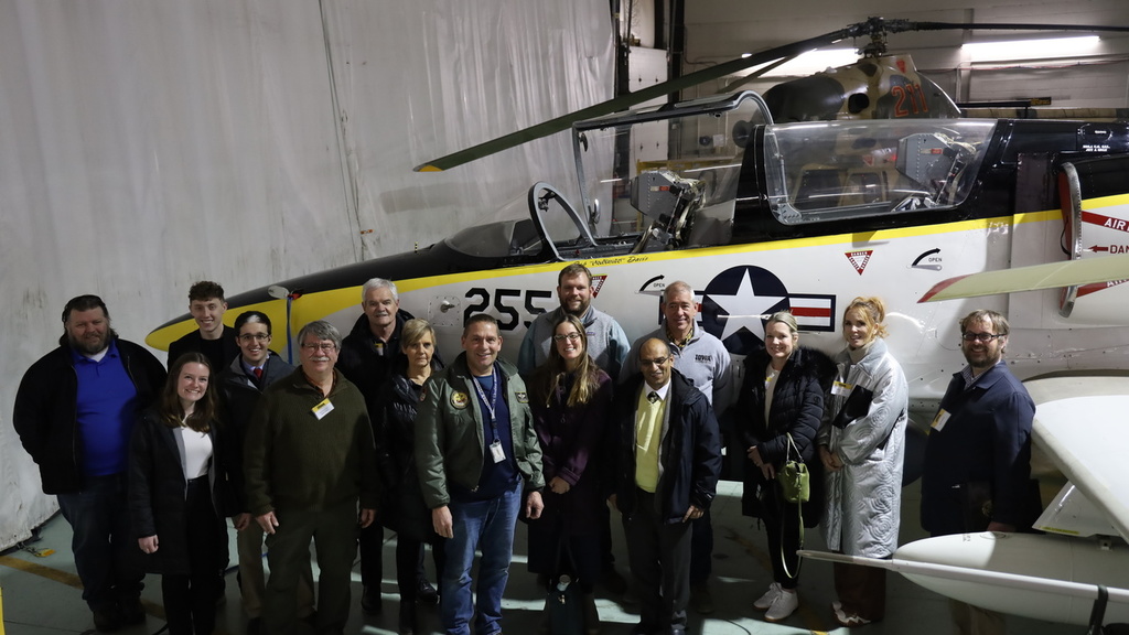 Group photo of Iowa legislators in the OPL hangar