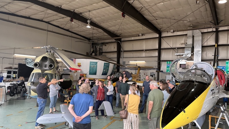 A group of people in the OPL hangar