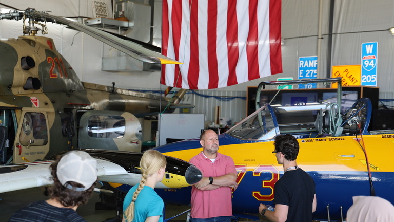 A tour group inside the OPL hangar